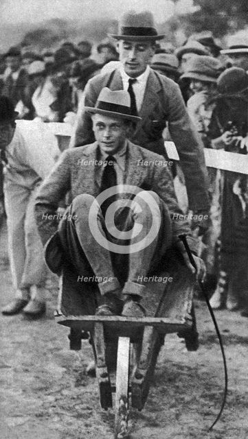 Louis Mountbatten wheels his cousin, the Prince of Wales, at a gymkhana in Malta, 1936. Artist: Unknown