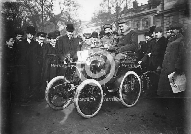 Louis Renault in the driver's seat of a Voiturette Renault 1¾ hp, 1899. Artist: Unknown