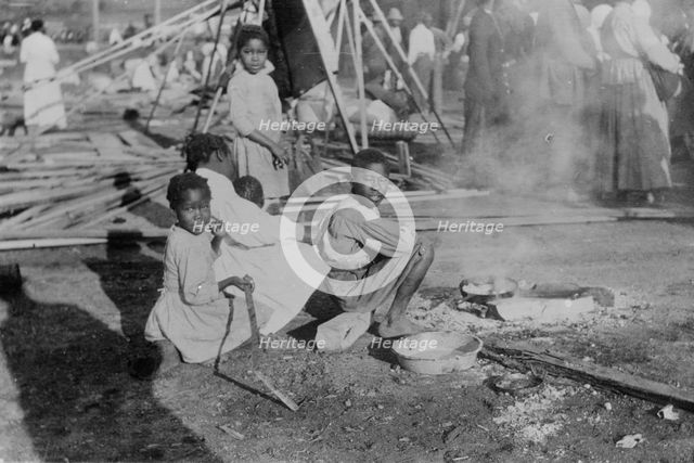 Louisiana Flood - refugees cook government rations, 1912. Creator: Bain News Service.