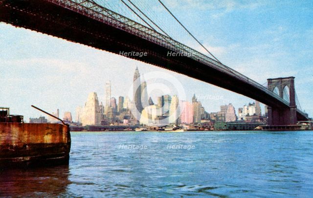 Lower Manhattan skyline from under the Brooklyn Bridge, New York City, New York, USA, 1956. Artist: Unknown