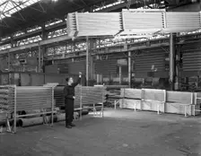 Lowering galvanised heat exchangers, Edgar Allen Steel Co, Sheffield, South Yorkshire, 1964. Creator: Michael Walters