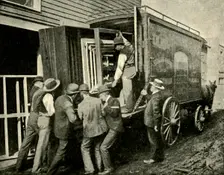 Loading The Camera On A Van For Removal 1901. Creator: Unknown