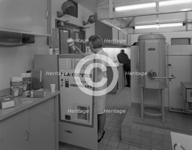 Loading a drinks vending machine at an experimental kitchen in Sheffield, South Yorkshire, 1966. Artist: Michael Walters