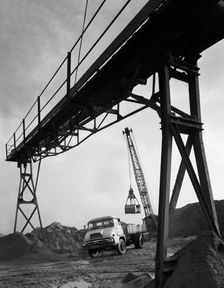 Loading a Ford Thames Trader tipper lorry, Finningley, near Doncaster, South Yorkshire, 1966. Creator: Michael Walters