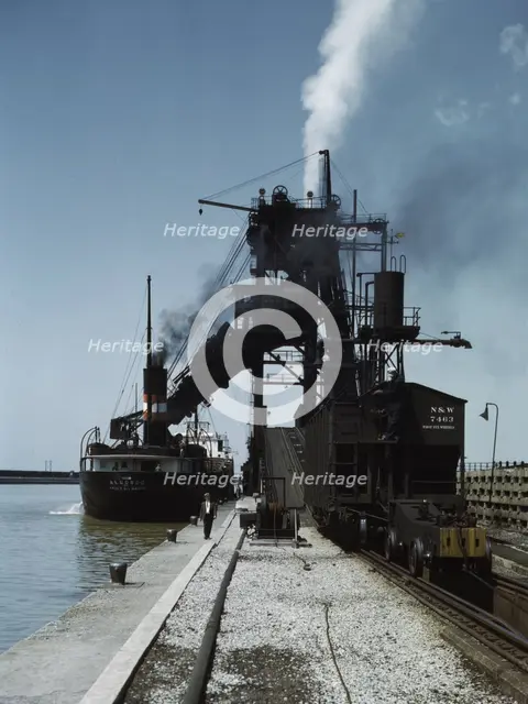 Loading a lake freighter with coal at the Pennsylvania R.R. coal docks...Sandusky, Ohio, 1943. Creator: Jack Delano.
