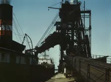 Loading a lake freighter with coal for shipment to other lake ports, Sandusky, Ohio, 1943. Creator: Jack Delano
