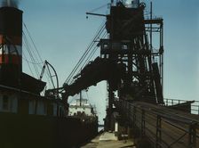 Loading a lake freighter with coal for shipment to other lake ports, Sandusky, Ohio, 1943. Creator: Jack Delano