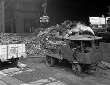 Loading a steam wagon with scrap at a steel foundry, Sheffield, South Yorkshire, 1965. Artist: Michael Walters