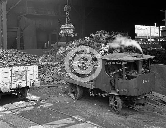 Loading a steam wagon with scrap at a steel foundry, Sheffield, South Yorkshire, 1965. Artist: Michael Walters
