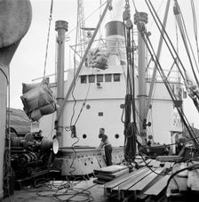 Loading a ship at the North Quay, West India Docks, London, c1945-c1965. Artist: SW Rawlings