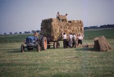 Loading bales of hay, England, c1960. Artist: CM Dixon