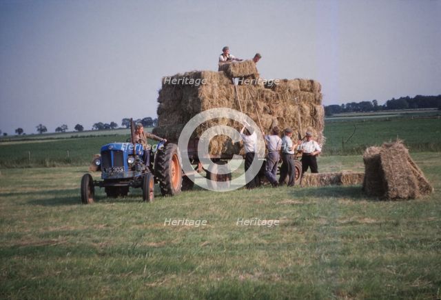 Loading bales of hay, England, c1960. Artist: CM Dixon.