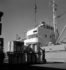 Loading cargo in the harbour of Gothenburg, Sweden, 1960. Creator: Torkel Lindeberg