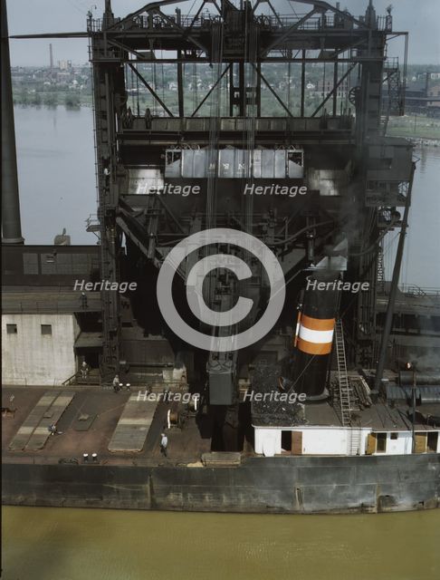 Loading coal into a lake freighter at the Pennsylvania Railroad docks, Sandusky, Ohio, 1943. Creator: Jack Delano.