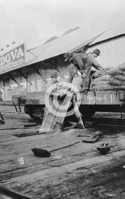 Loading copper, between c1900 and c1930. Creator: Unknown.