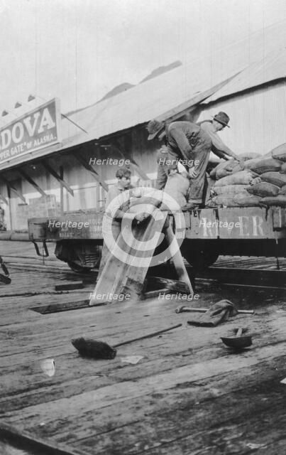 Loading copper, between c1900 and c1930. Creator: Unknown.