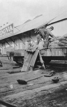 Loading copper, between c1900 and c1930. Creator: Unknown
