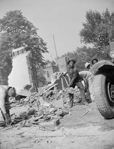 Loading debris from wrecked buildings along Independence Avenue, Washington, D.C, 1942. Creator: Gordon Parks
