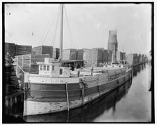 Loading lumber on steamer at lumberyards, Menominee, Mich., between 1880 and 1899. Creator: Unknown