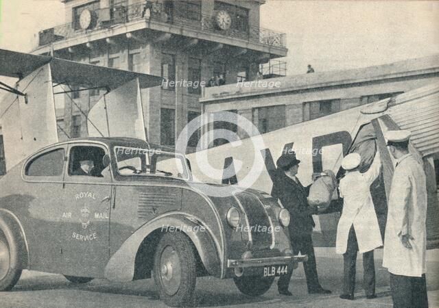 Loading mails on board an Imperial Airways liner at Croydon Airport, c1936  (c1937). Artist: GPO.