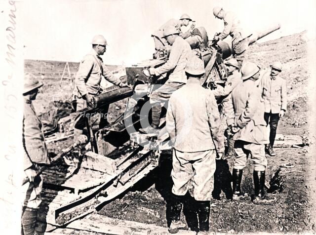 Loading shell into 155 mm gun, c1914-c1918. Artist: Unknown.