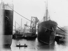 Loading steamers in Montreal harbor, between 1880 and 1901. Creator: Unknown