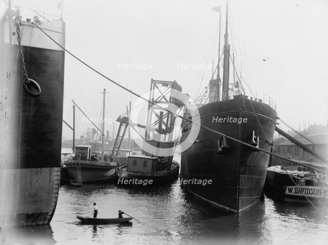 Loading steamers in Montreal harbor, between 1880 and 1901. Creator: Unknown.