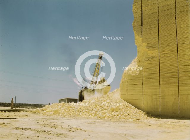Loading sulphur from vat, Freeport Sulphur Co., Hoskins Mound, Texas, 1943. Creator: John Vachon.