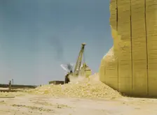 Loading sulphur from vat, Freeport Sulphur Co., Hoskins Mound, Texas, 1943. Creator: John Vachon