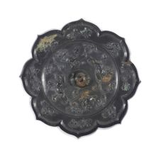 Lobed Mirror with Birds, Lions, and Floral Sprays, Tang dynasty (A.D. 618-907), 8th century. Creator: Unknown