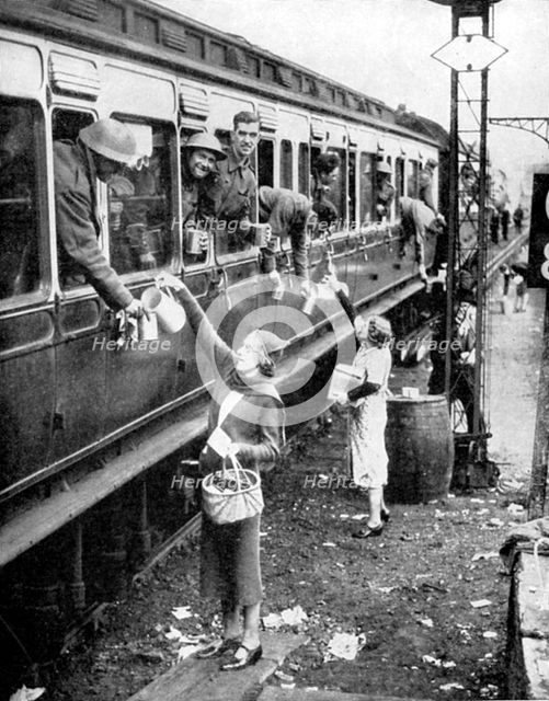Local residents supplying refreshments to soldiers evacuated from Dunkirk, World War II, 1940. Artist: Unknown