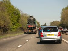 Locomotive being transported by heavy goods vehicle on A31 2015. Creator: Unknown