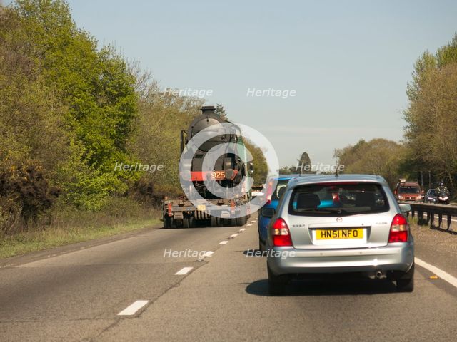 Locomotive being transported by heavy goods vehicle on A31 2015. Creator: Unknown.