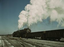 Locomotive in a railroad yard, Chicago and Northwestern RR (?), near Chicago, Ill.(?), 1942 or 1943. Creator: Jack Delano