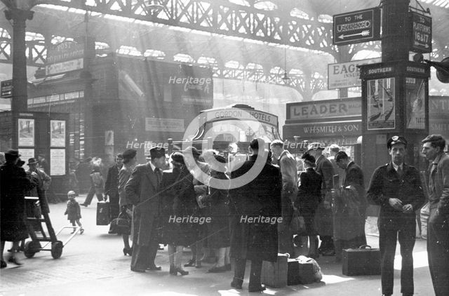 Locomotive spotters at Victoria Station, London, 1950. Creator: Henry Grant.