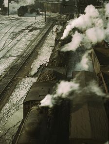 Locomotives lined up for coal, sand and water at the coaling station in the 40..., Chicago, 1942. Creator: Jack Delano