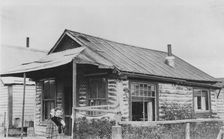 Log cabin, between c1900 and 1916. Creator: Unknown