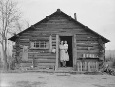 Log house now occupied and enlarged by the Halley family, Bonner County, Idaho, 1939. Creator: Dorothea Lange
