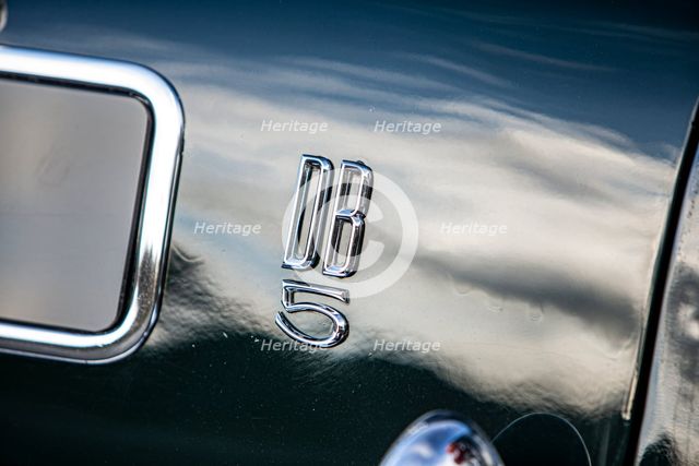 Logo on a 1965 Aston Martin DB5. Creator: Unknown.