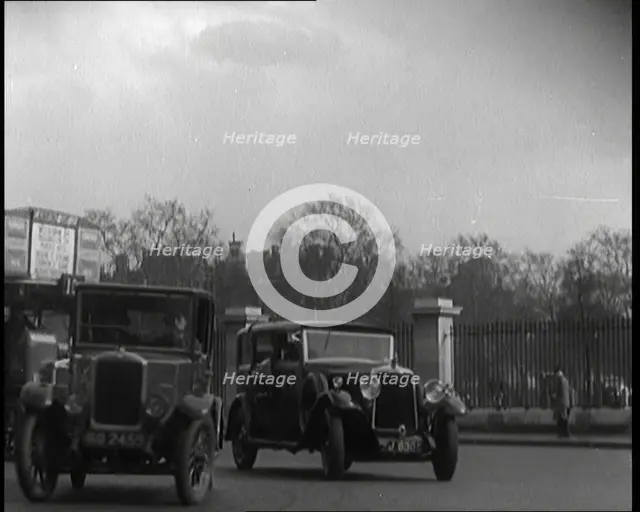 London Bus, Cars and Taxis Turning a Corner on a London Street, 1924. Creator: British Pathe Ltd.