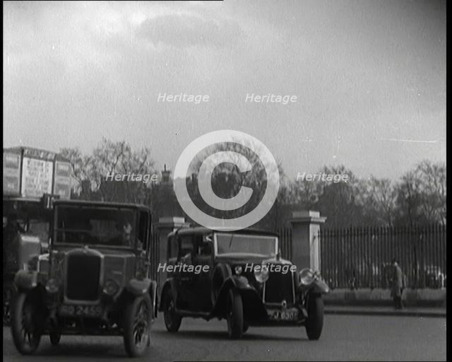 London Bus, Cars and Taxis Turning a Corner on a London Street, 1924. Creator: British Pathe Ltd.