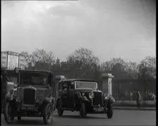 London Bus, Cars and Taxis Turning a Corner on a London Street, 1924. Creator: British Pathe Ltd