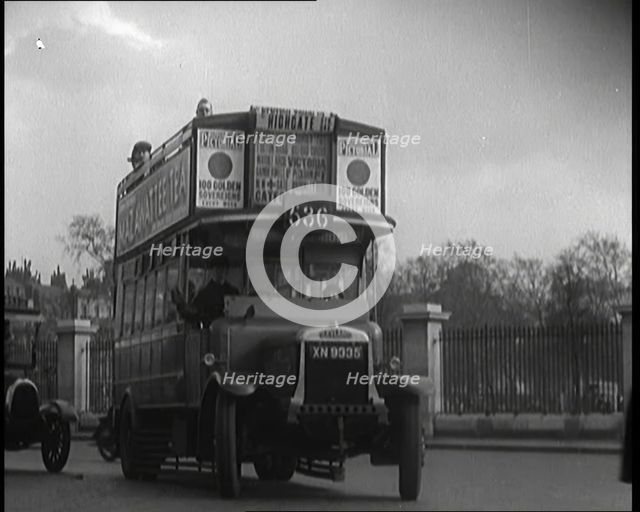 London Bus, Cars and Taxis Turning a Corner on a London Street , 1924. Creator: British Pathe Ltd.