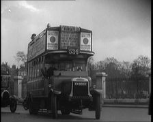 London Bus, Cars and Taxis Turning a Corner on a London Street , 1924. Creator: British Pathe Ltd