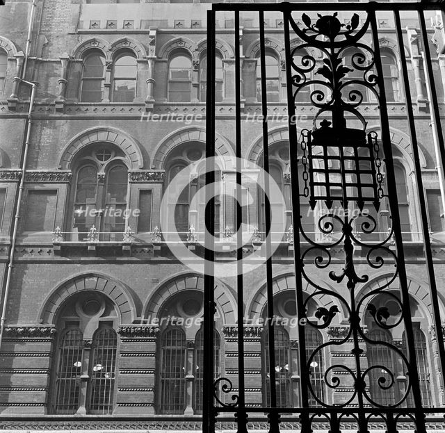 Looking up past the ornate iron gates of Westminster Palace Gardens to the facade...London, 1965-75. Creator: John Gay.