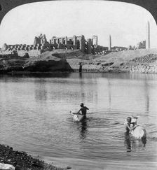 Looking across the Sacred Lake to the great temple at Karnak, Thebes, Egypt 1905.Artist: Underwood & Underwood