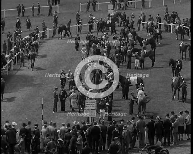 Looking Down Into One of the Enclosures at  Goodwood Race Course in Sussex with Spectators..., 1939. Creator: British Pathe Ltd.