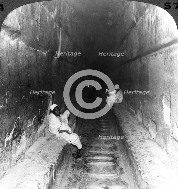 'Looking down the main passage to Khufu's sepulchre within the Great Pyramid, Egypt', 1905.Artist: Underwood & Underwood