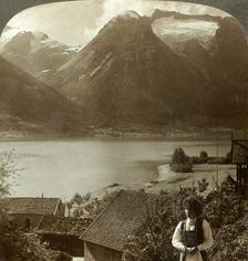 Looking from Hjelle across quiet Strynns Lake to steep glaciers of Mt. Skaala, Norway c1905. Creator: Unknown