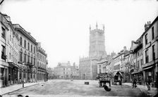 Looking into the Market Place towards St John the Baptist's Church, Cirencester, Glos, 1860-1922. Creator: Henry Taunt